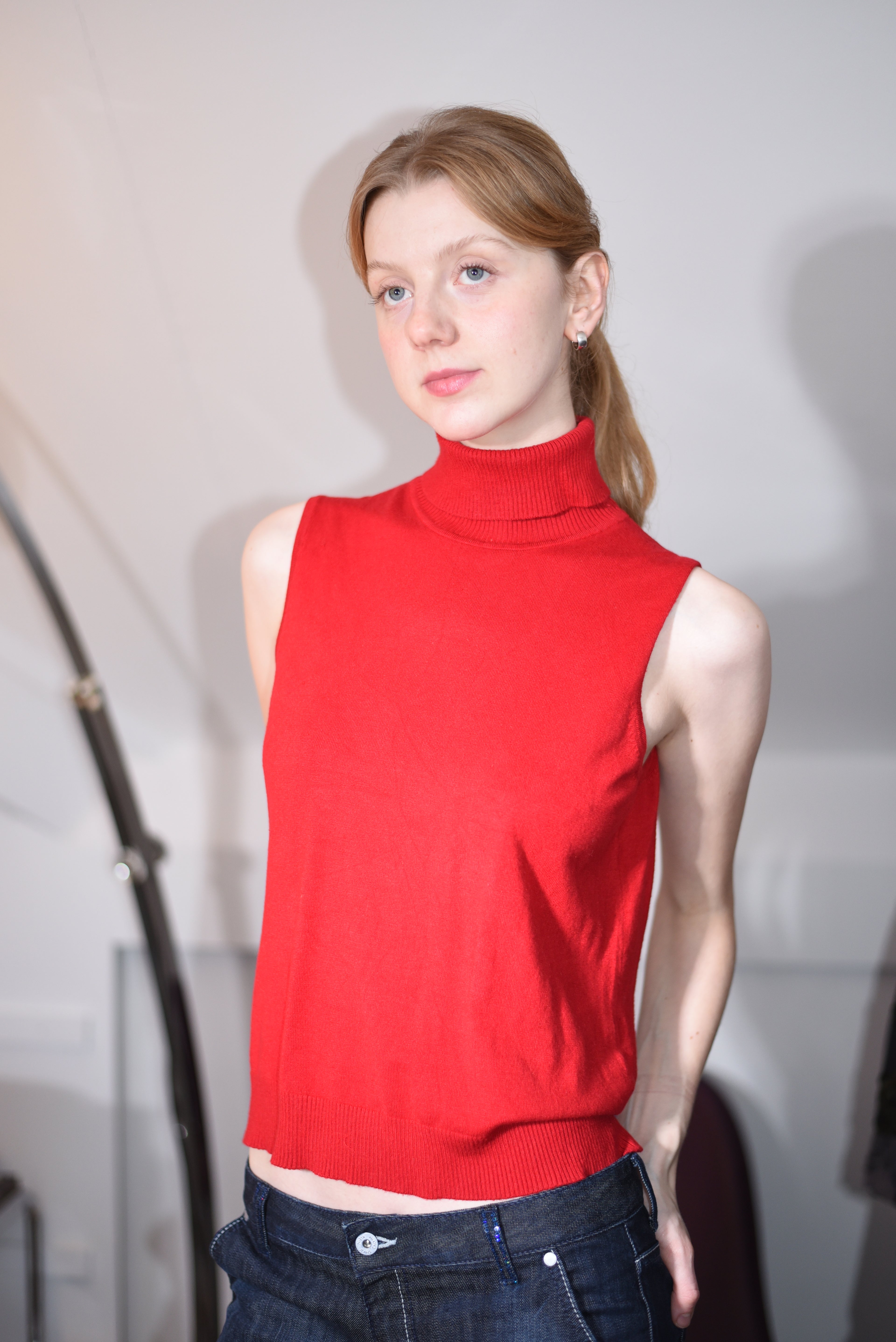 Red sleeveless turtleneck top