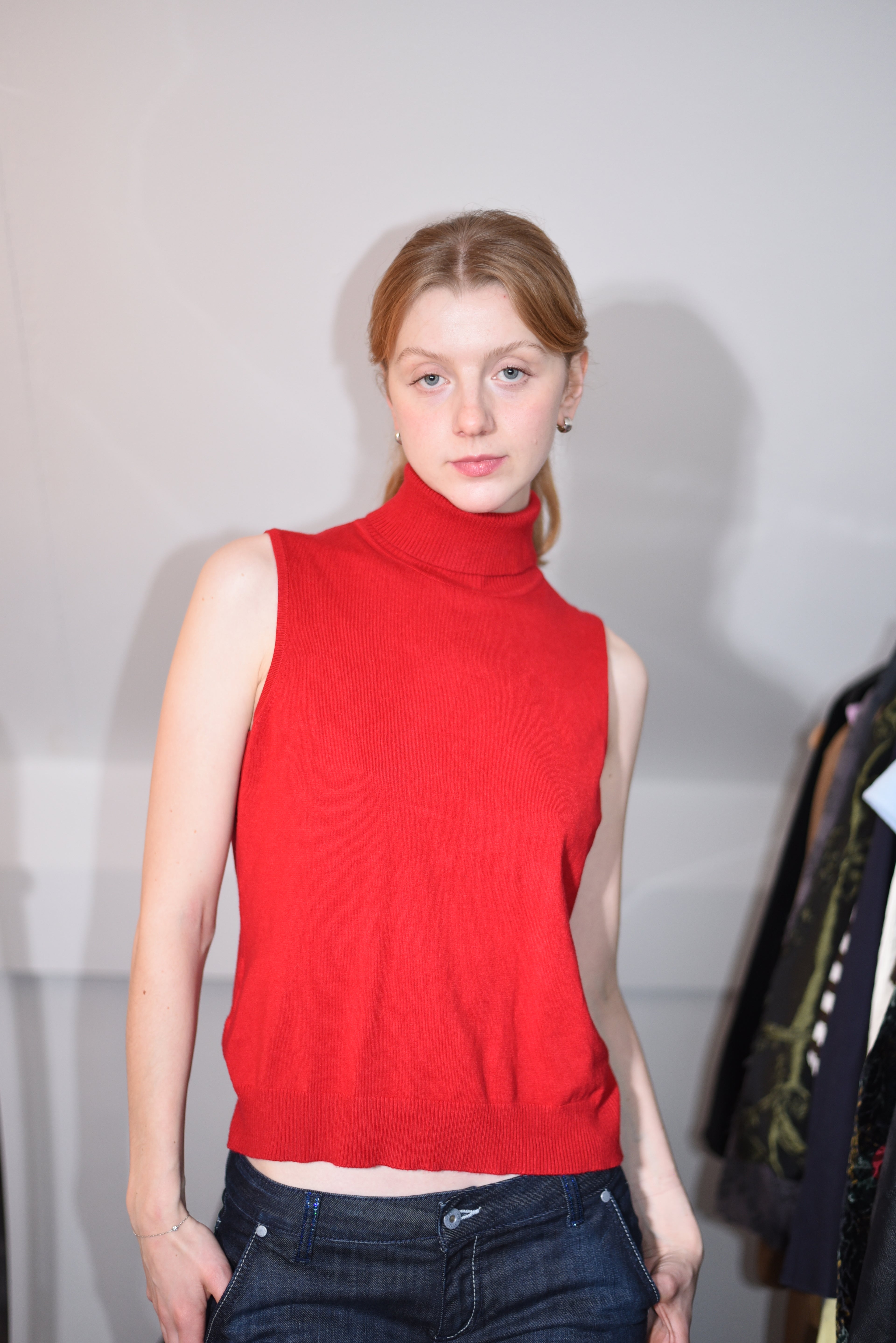 Red sleeveless turtleneck top