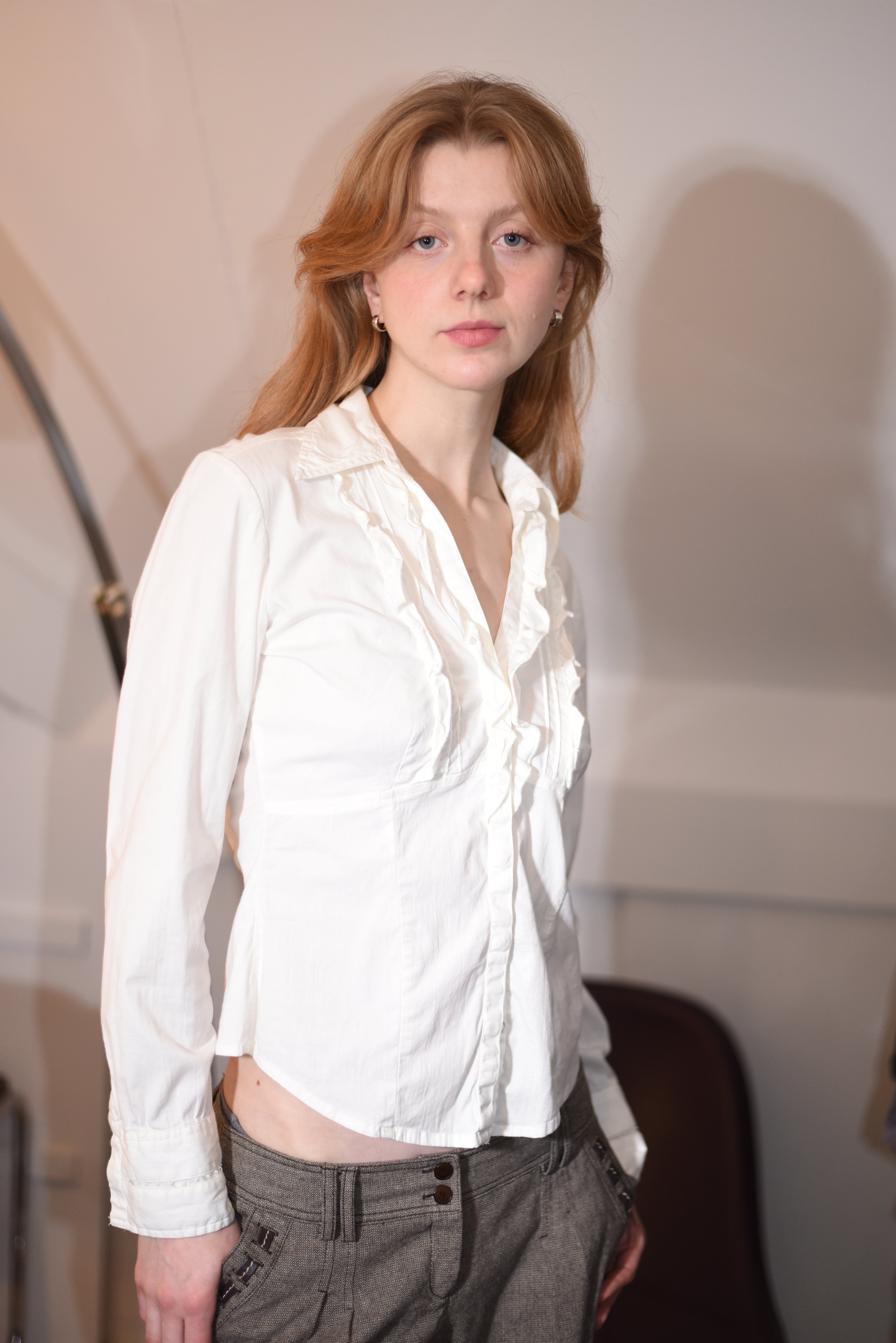 White ruffled blouse